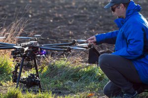 Drone Operator Adjusting Drone Propellers