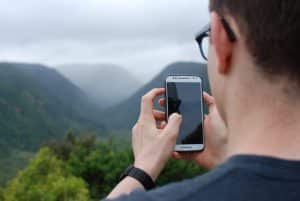 Man Taking Picture on Phone