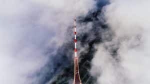 Red and White Pole in Clouds