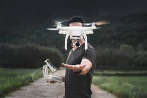 Man Releasing Drone in Air