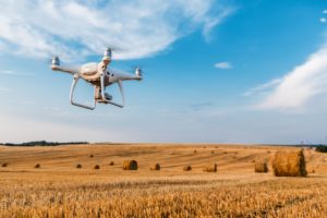 Drone Flying Over Yellow Field
