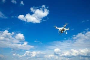 Drone Flying In Blue Sky