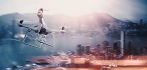 White Drone Flying Over City