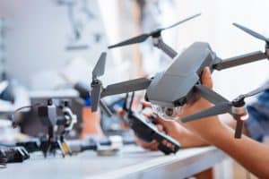 Man Holding Drone And Controller