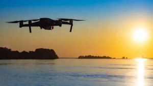 Drone flying over water