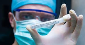Scientist Holding Syringe Stating Coronavirus