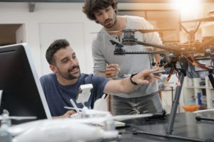 Drone Pilots Inspecting Drone