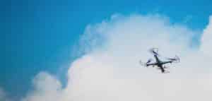 Black Drone Flying in Sky