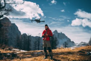 Photographer Flying Drone in Mountains