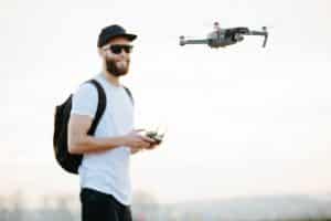 Man Flying Drone In City