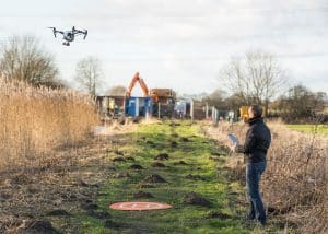 Man Operating Drone in Field