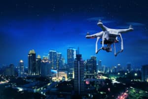 White Drone Flying Over City