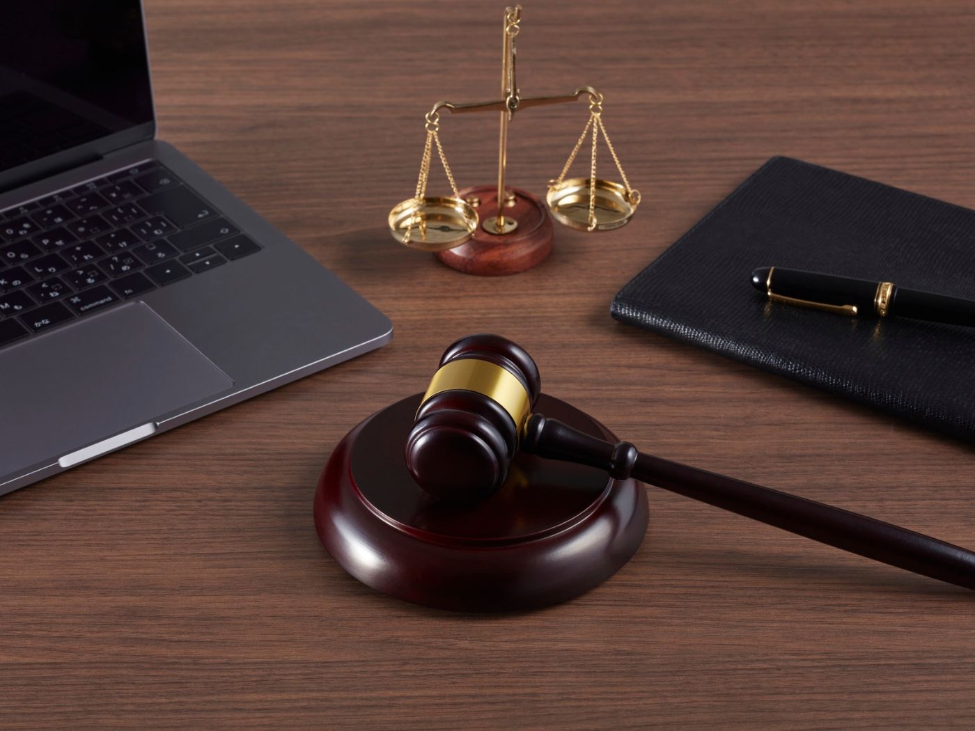 A depiction of a gavel and scales to represent that this is an article about compliance with key aviation legistlation EC 785/2004