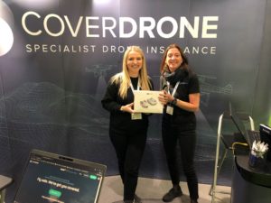 Drone X Competition Giveaway Jess and Ada holding the DJI Mini 2 Prize