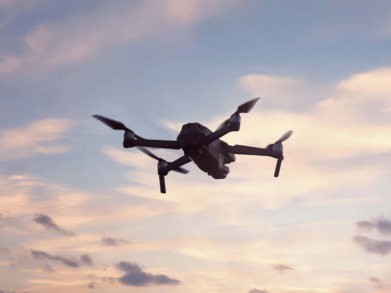 Drone flying outdoors to illustrate how to reduce the risk of drone flyaways