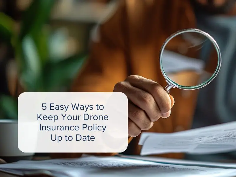 Someone examining their drone insurance policy with a magnifying glass