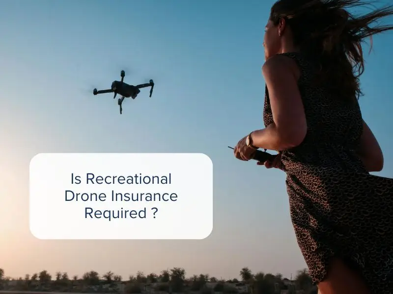 Recreational drone pilot operating her drone in a field